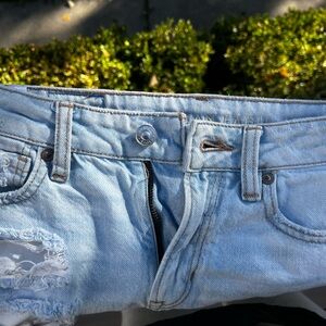 Heavily ripped light wash American Eagle straight leg pants (size 000)